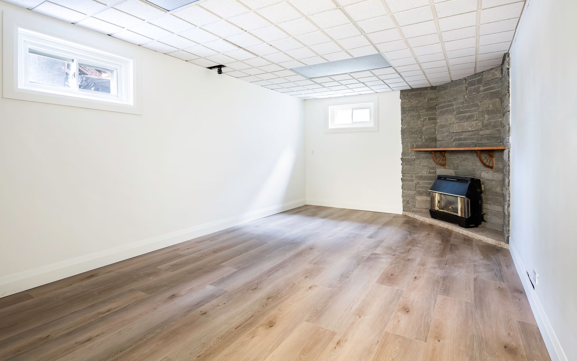 There is a fireplace in the corner of the room.