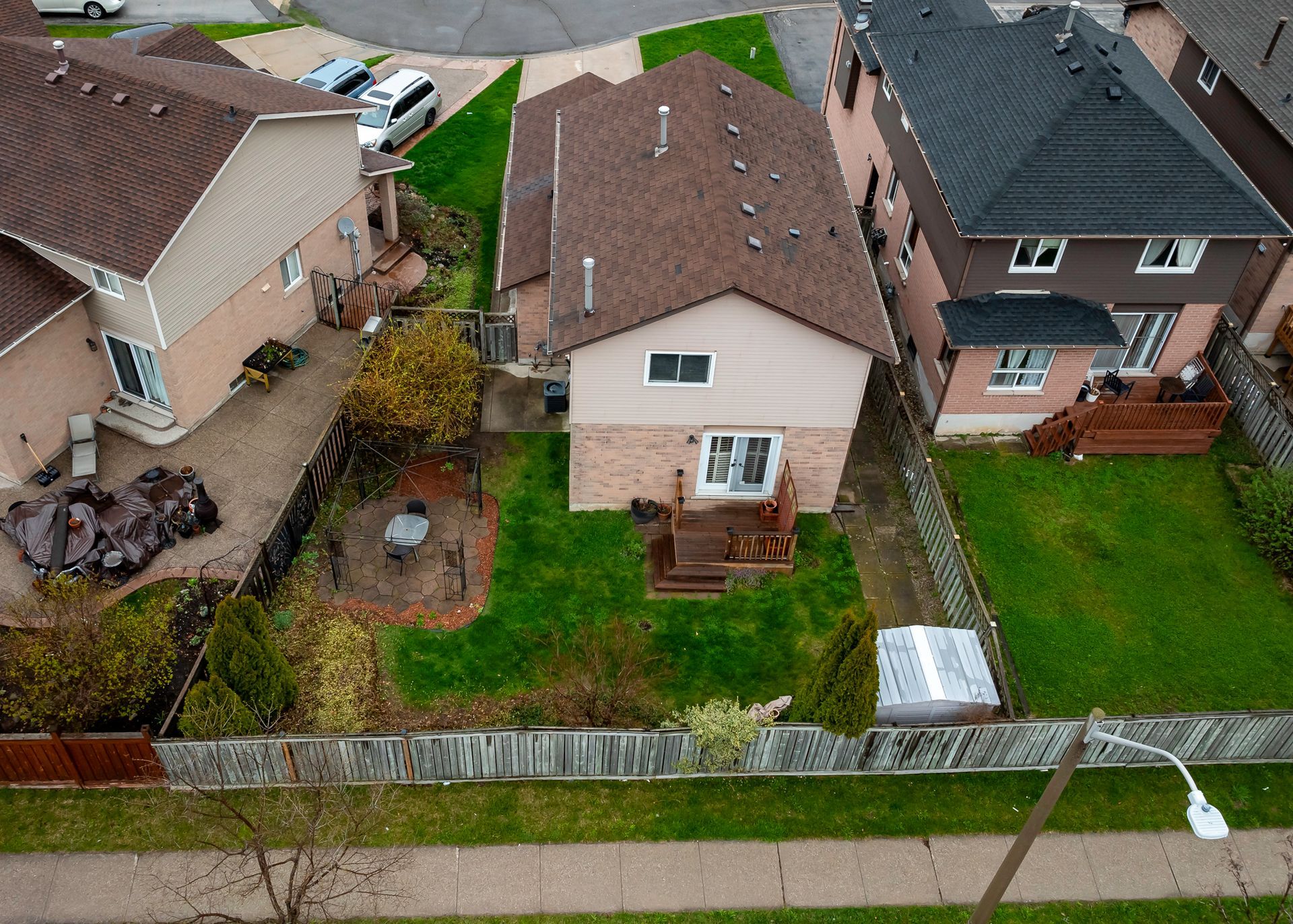 An aerial view of a house in a residential area