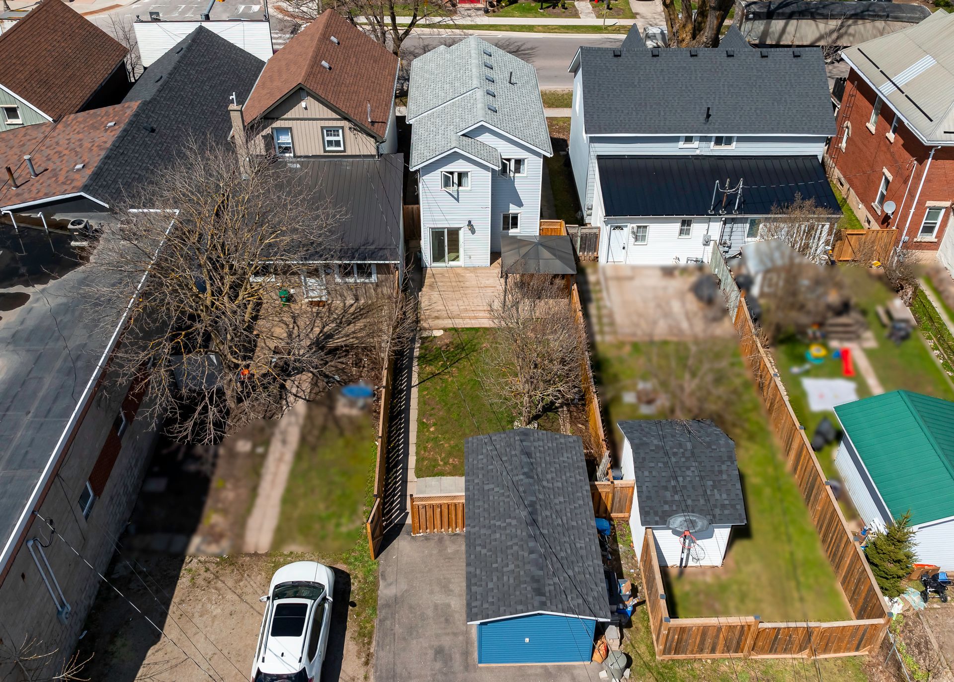 An aerial view of a house with a car parked in front of it.