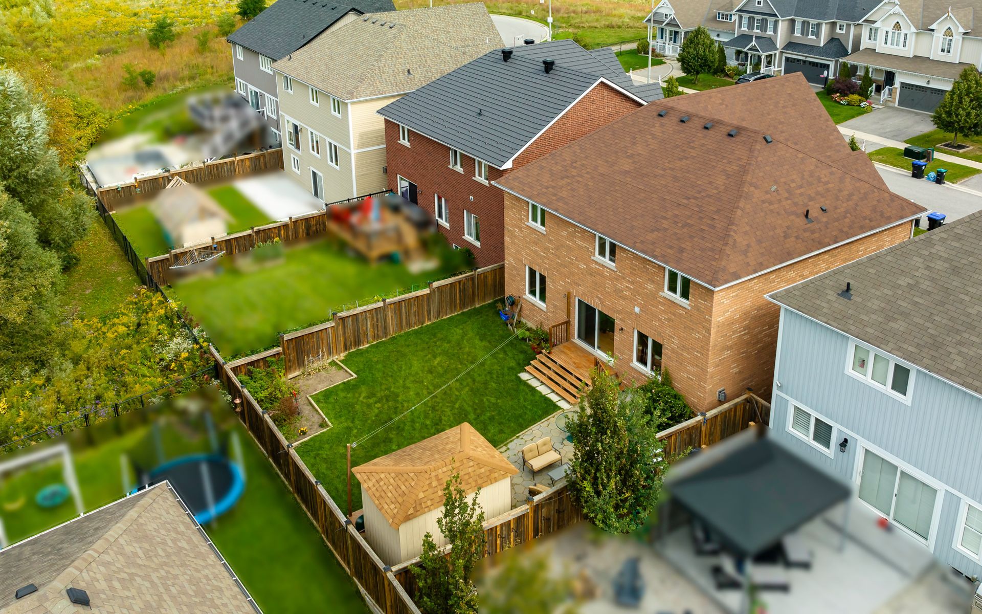 An aerial view of a residential neighborhood with houses and yards.