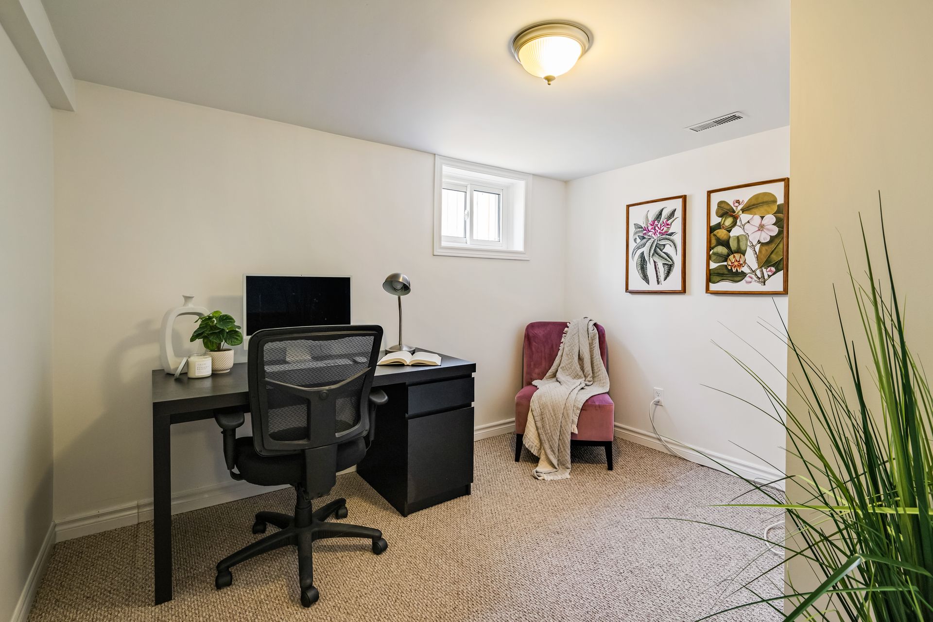 There is a desk and chair in the room.