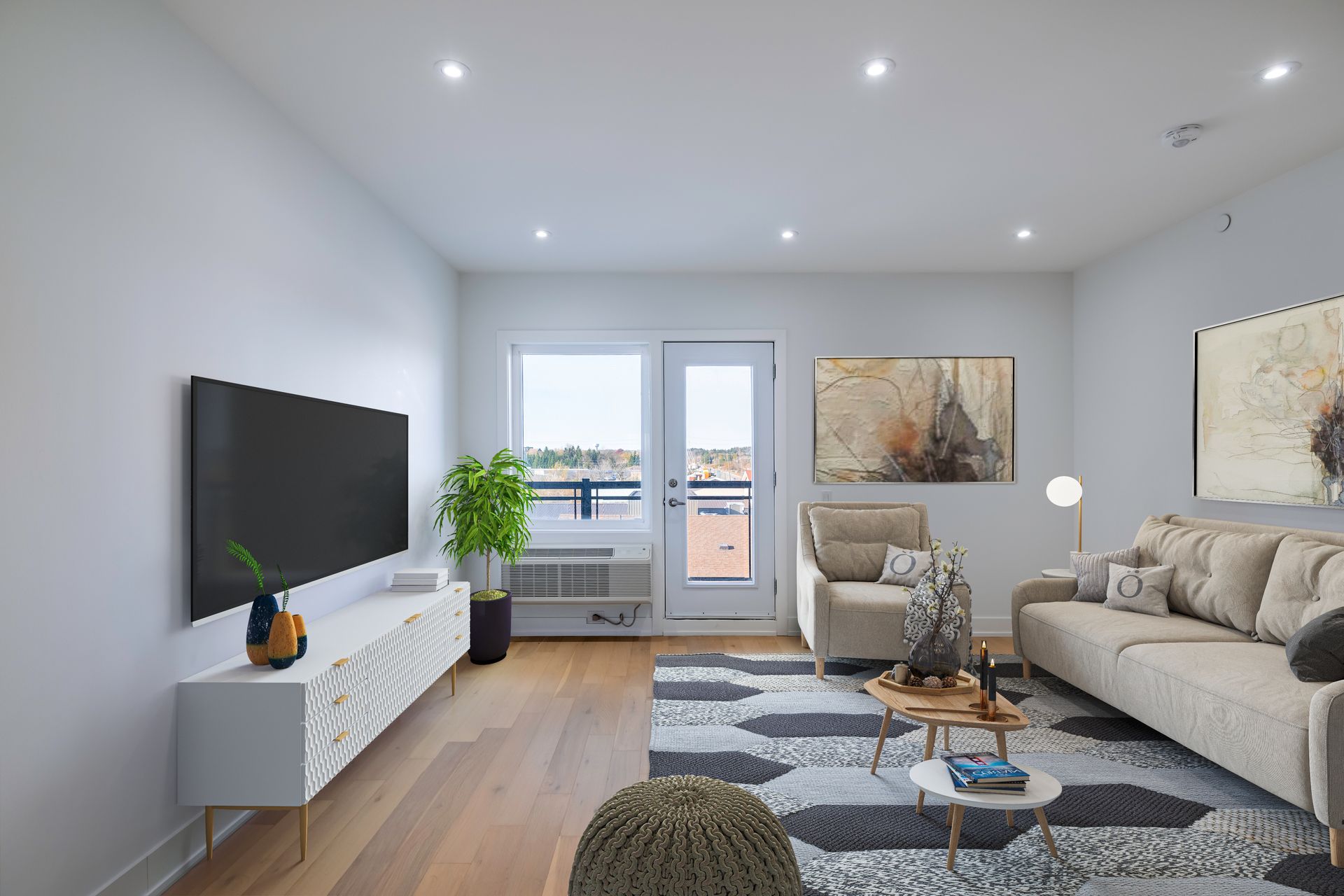 A living room with a couch , chair , table and television.
