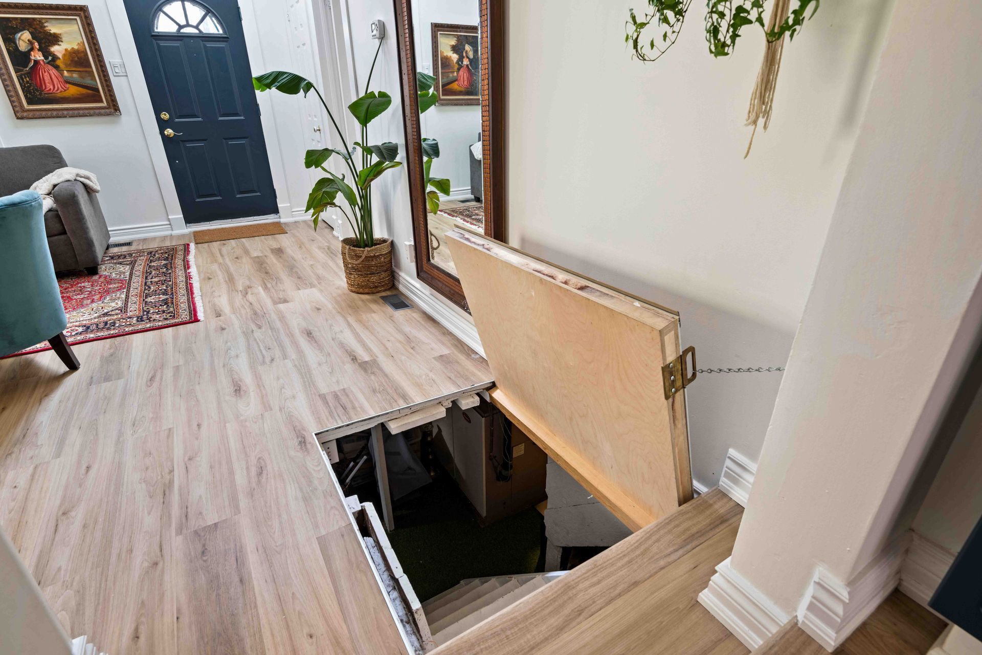 There is a secret room under the stairs in the living room.