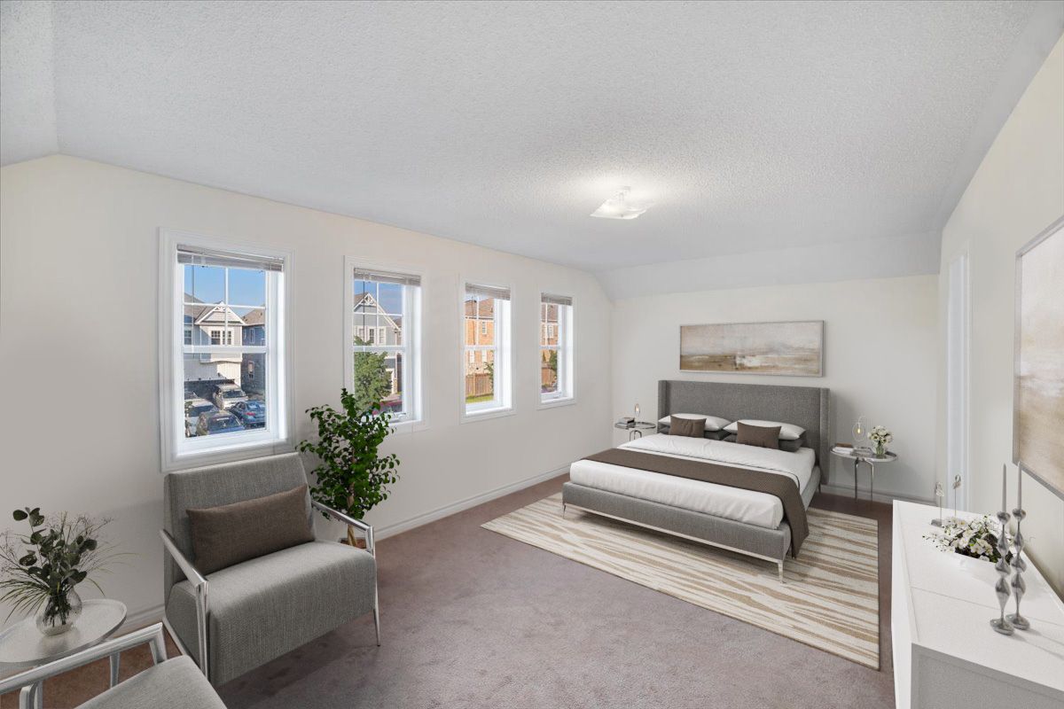 A bedroom with a bed , chair , dresser and windows.