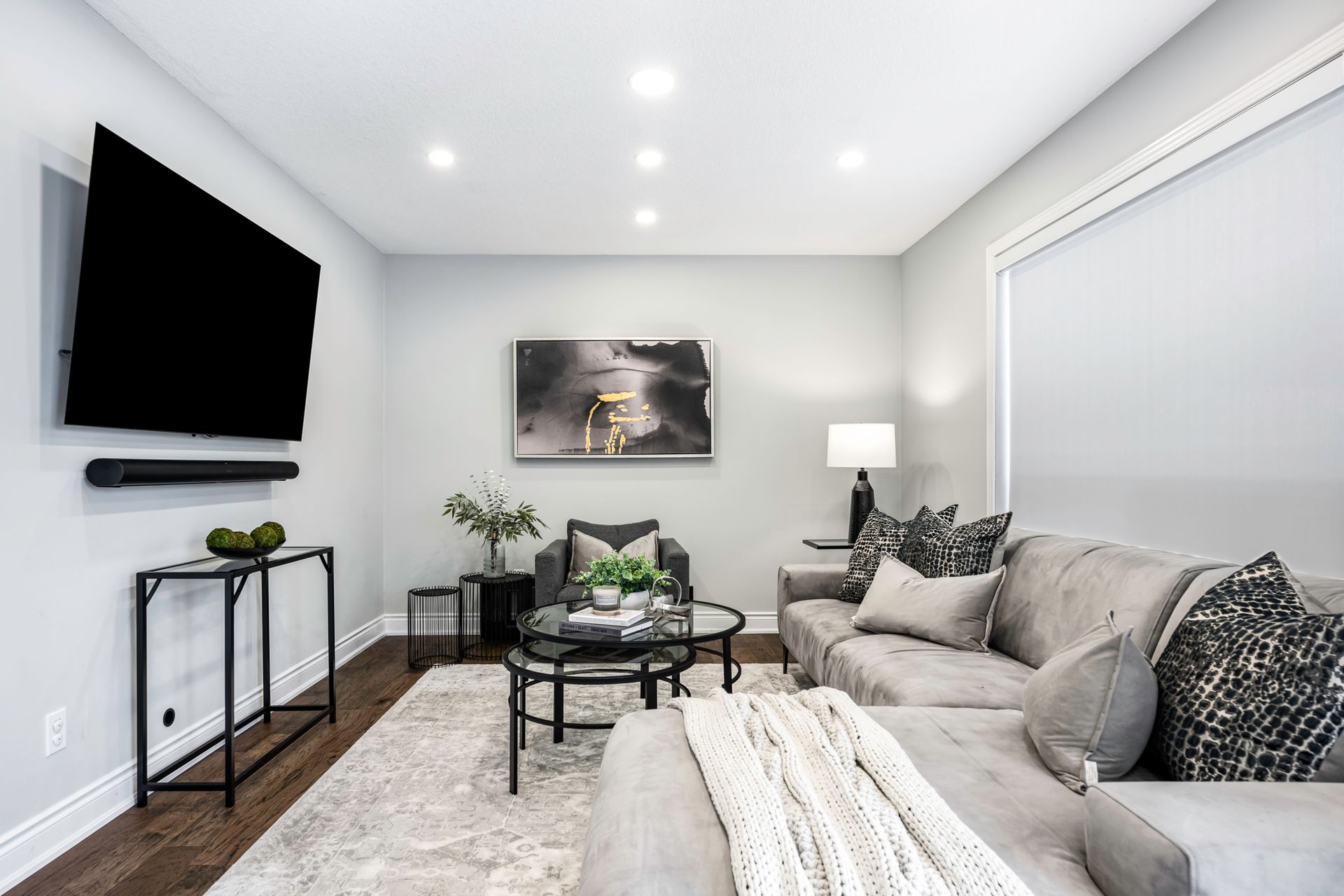 A living room with a couch and a flat screen tv