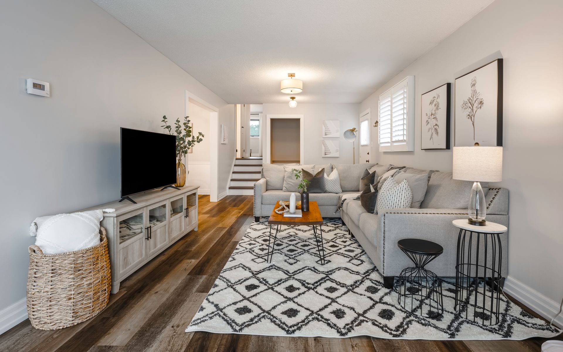 A living room with a couch and a flat screen tv
