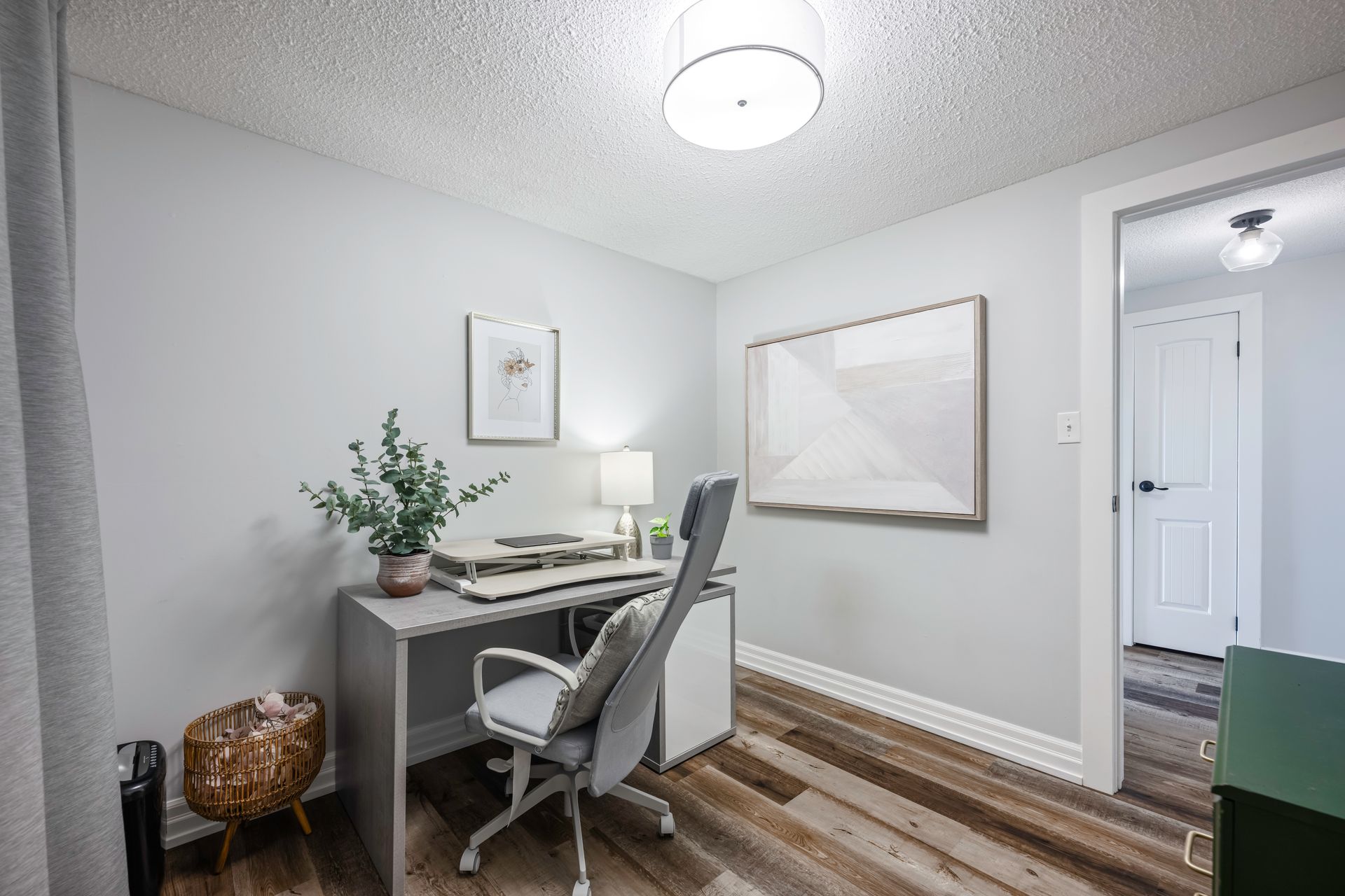 There is a desk and chair in the room.