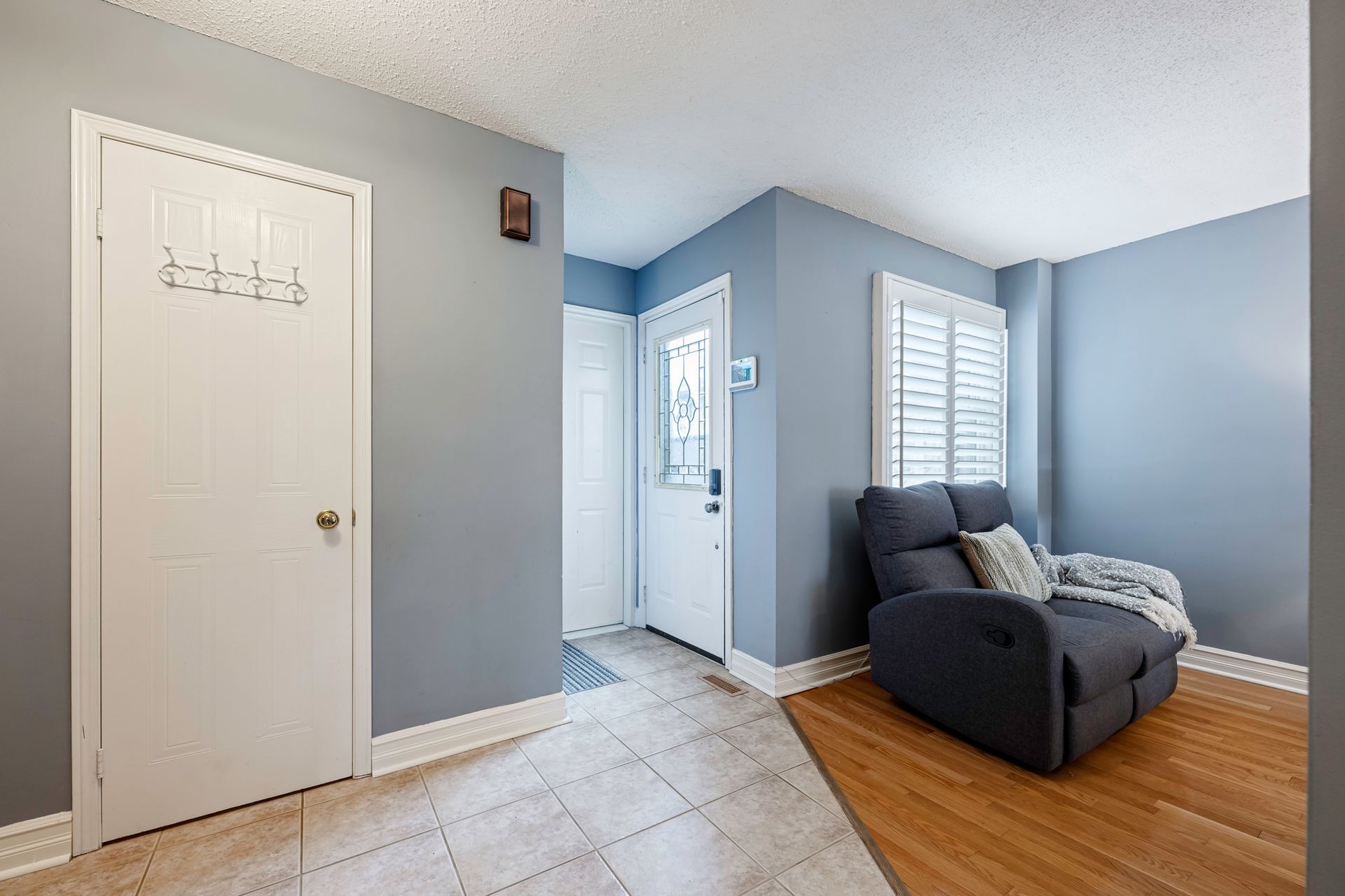 A living room with a couch and a door.