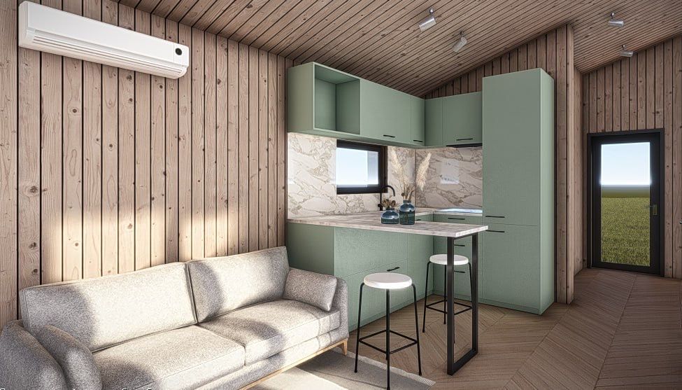 Small cabin interior with light wood paneling, green cabinets, and a white sofa.
