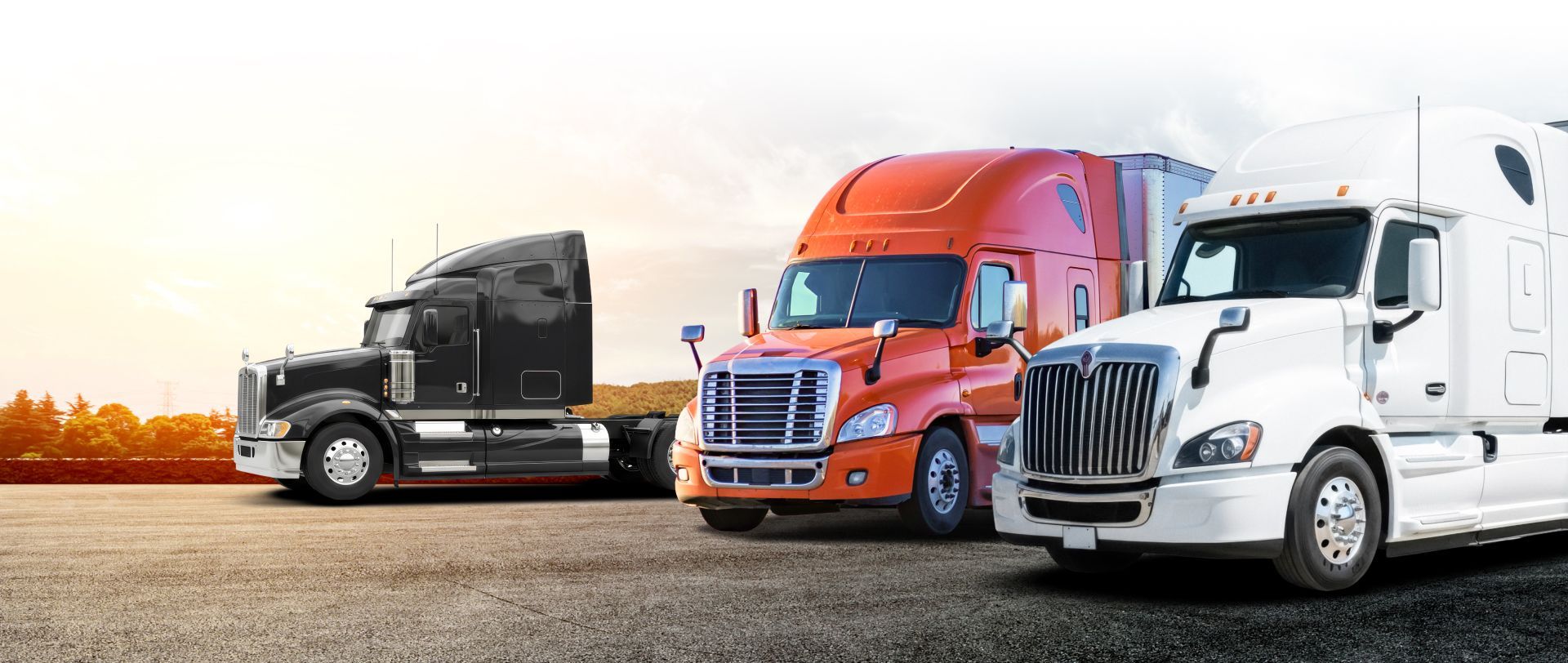 Three semi-trucks parked side by side on a gravel lot at sunset | S&V Diesel Repair