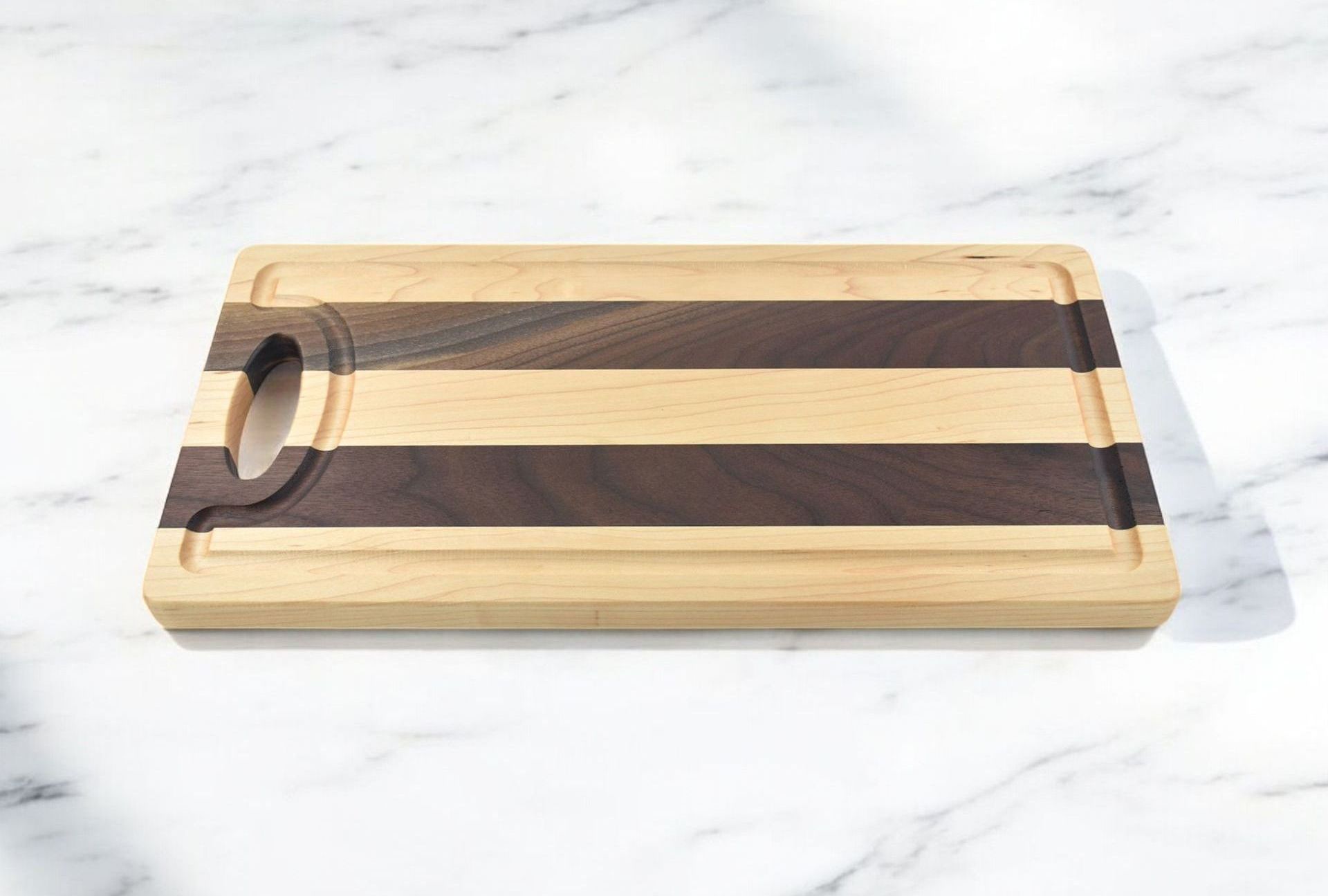 A wooden cutting board is sitting on a marble counter top