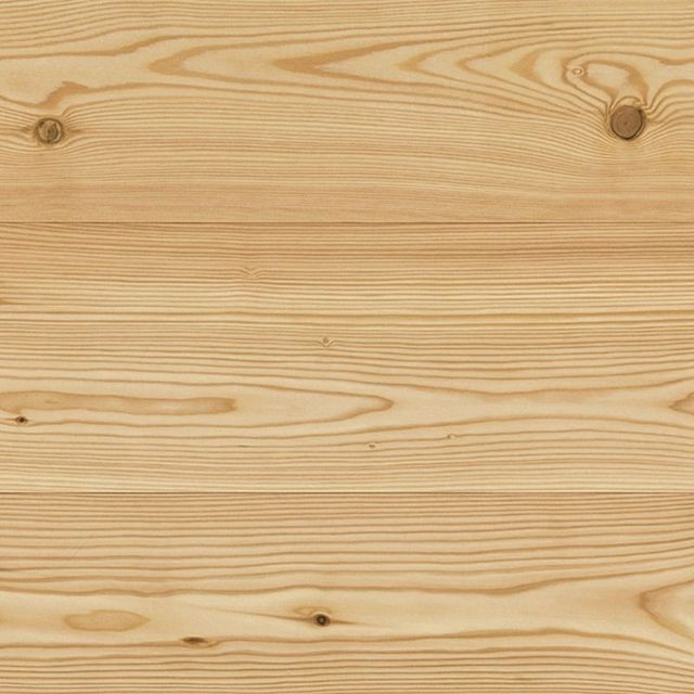Tavole di legno con venature e nodi visibili, colore marrone chiaro.