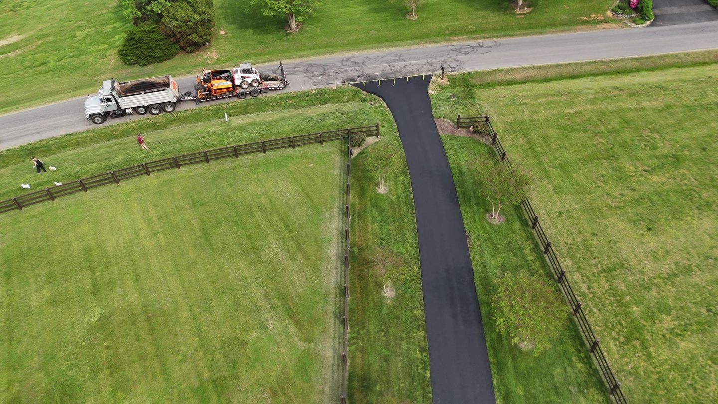 No driveway to long or short for us. We repaired the bad areas and resurfaced this driveway to give it a fresh look. 