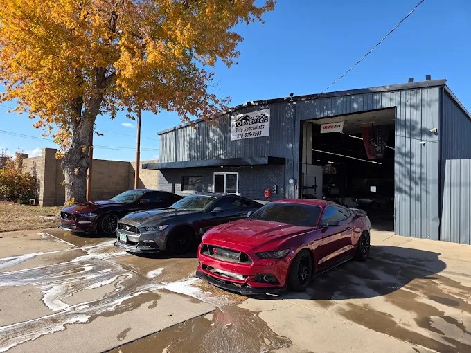 Three Ford Mustangs in Red, Gray, and Black Parked in Front of The Shop | CRF Automotive Specialists