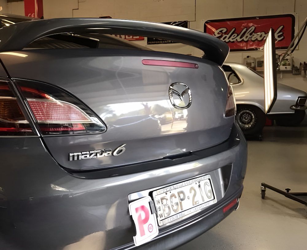 A Grey Mazda 6 Is Parked In A Garage — Rapid Auto Dent In Gosford, NSW