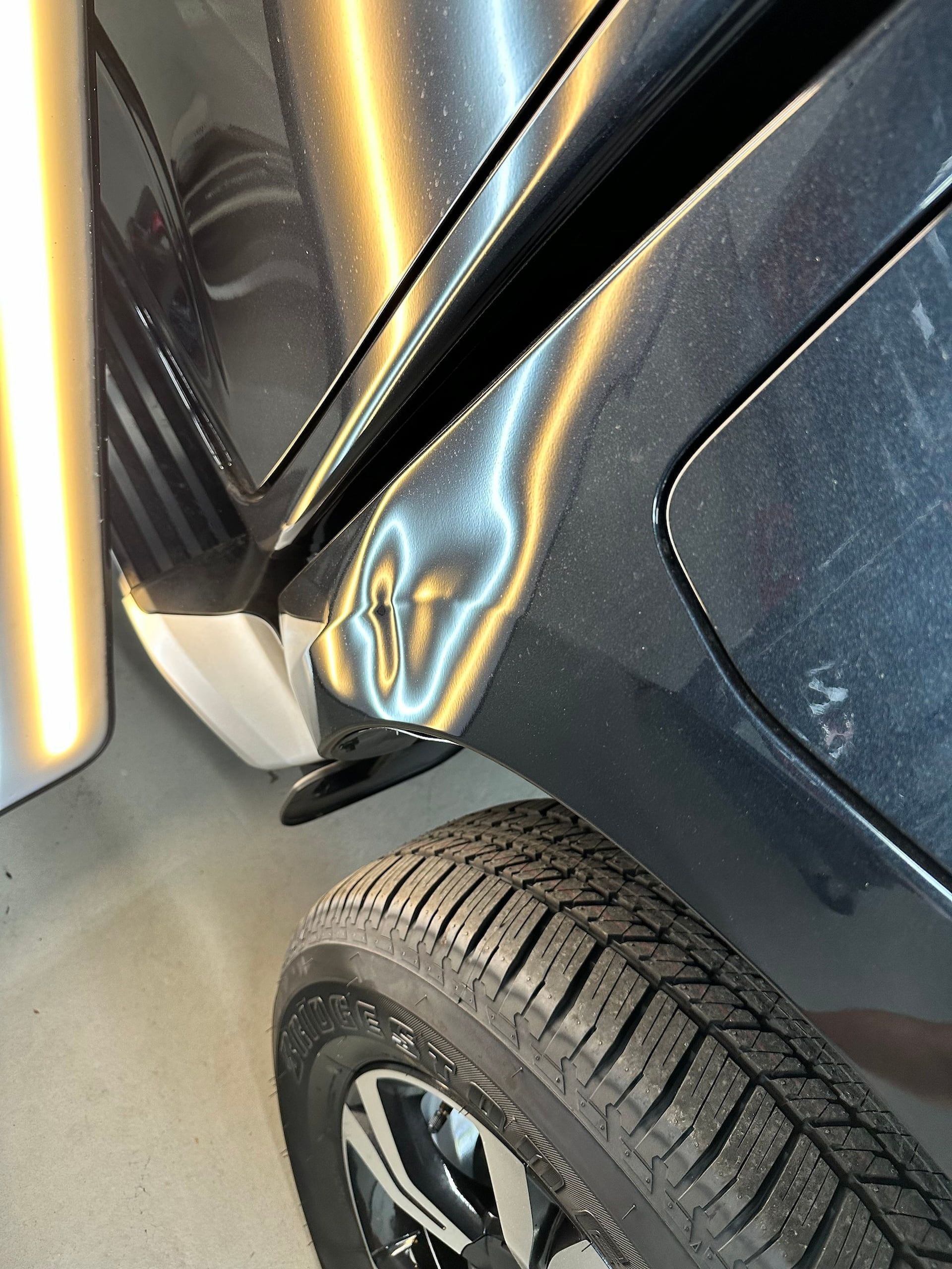 A Close Up of a Car With a Dent in the Fender — Rapid Auto Dent In Lake Haven, NSW