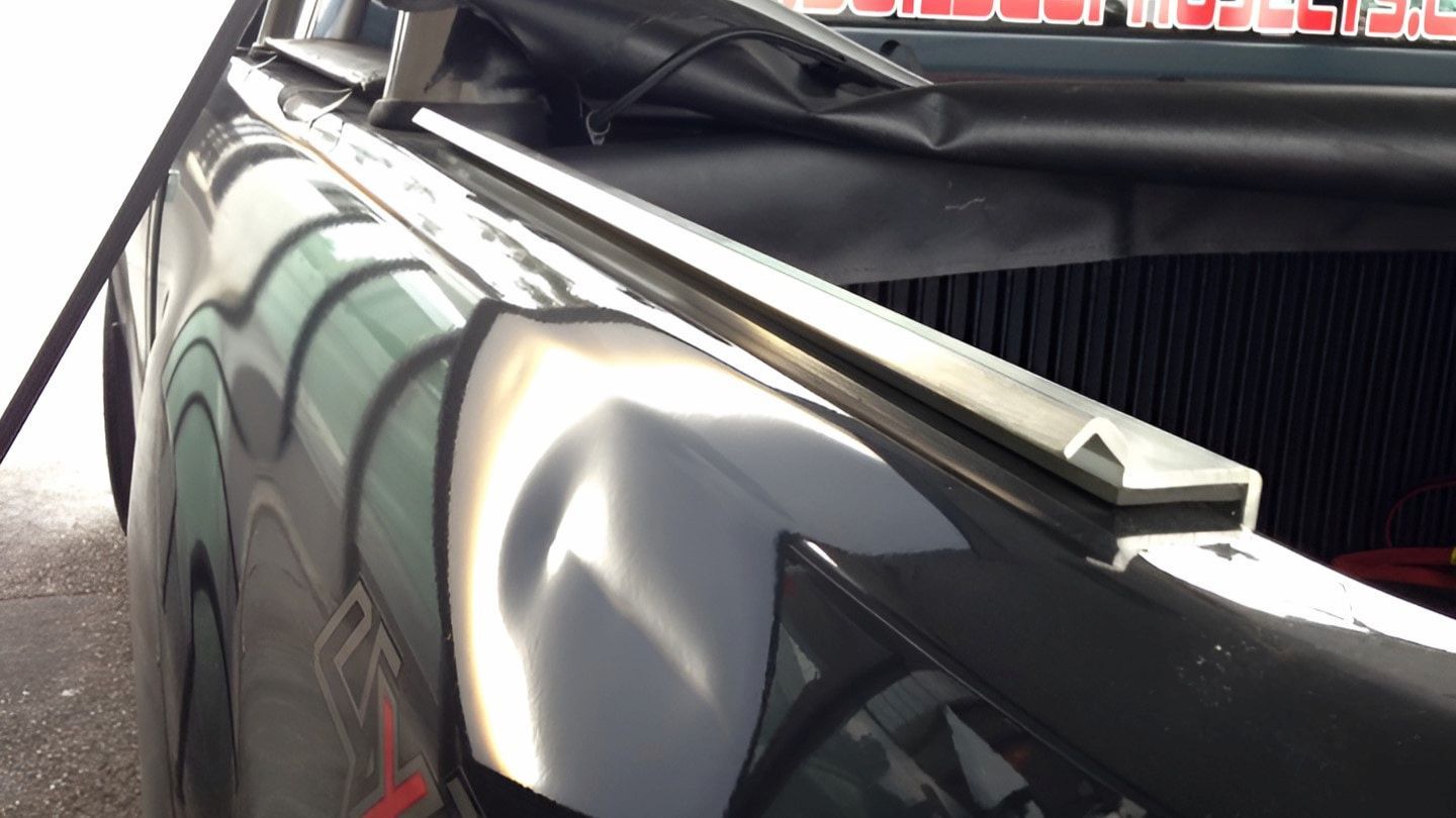 A Black Truck With a Sticker on the Back — Rapid Auto Dent In Umina, NSW