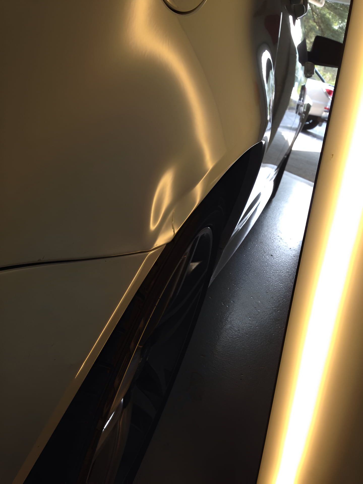 A Close Up of a Car With a Dent on the Side — Rapid Auto Dent In Umina, NSW
