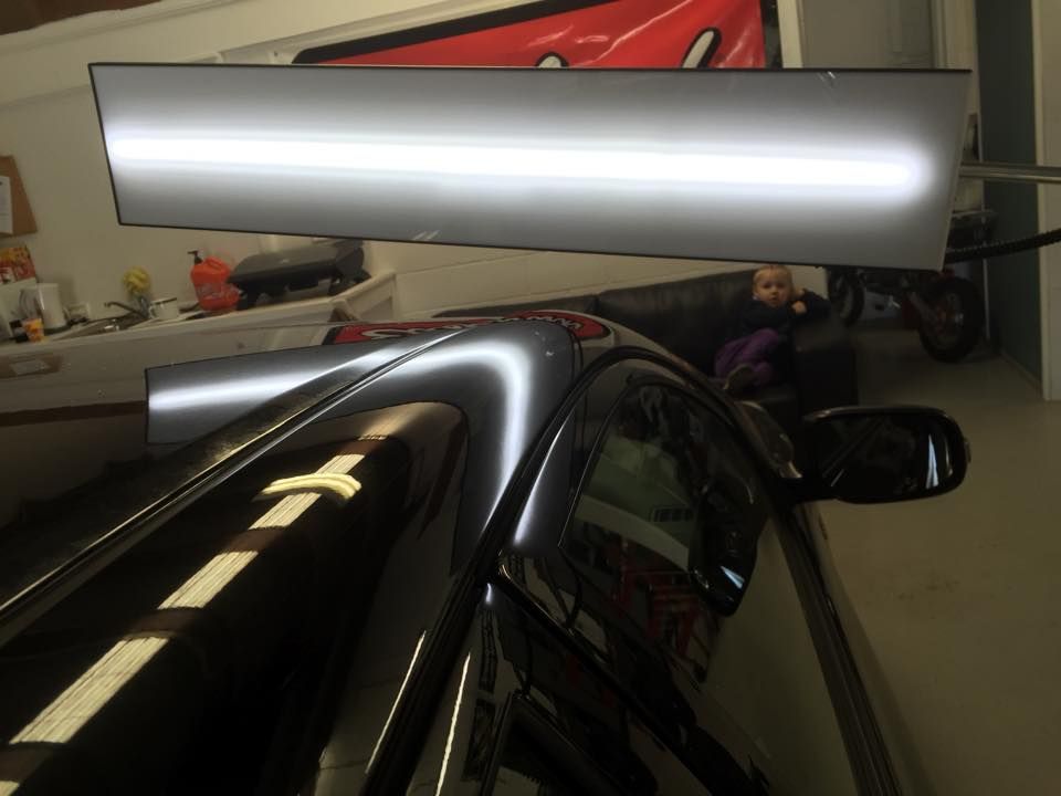 A Row Of Cars Are Parked In A Garage With Their Hoods Open — Rapid Auto Dent In West Gosford, NSW