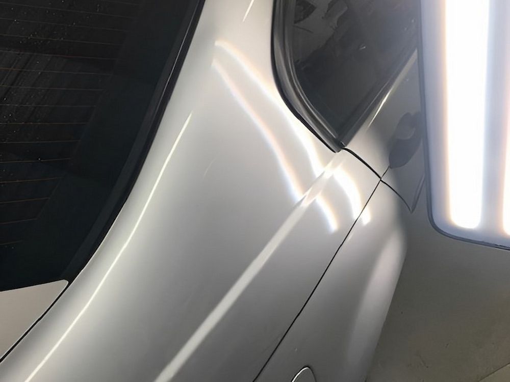 A close up of a silver car with a light on it — Rapid Auto Dent In Erina, NSW