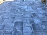 Blue-gray stone paver walkway with rectangular tiles arranged in a patterned path