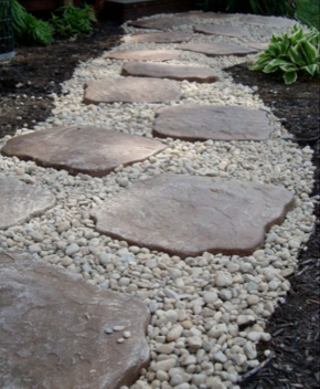 Stepping stones set in white pebbles form a garden path