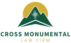 Logo for Cross Monumental Law Firm: Green mountain silhouette with gold sunburst background, white cross design.