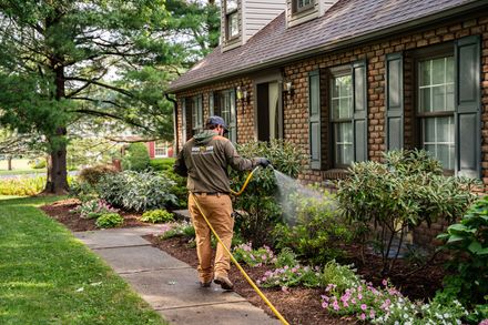 Bug Off technician inspecting home foundation