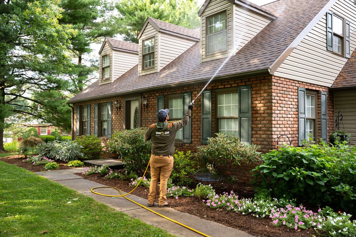 Bug Off technician at a Carlisle home front door