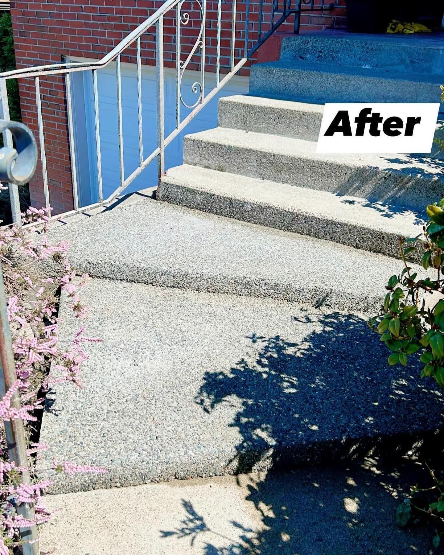 Concrete steps and landing with white railing, text