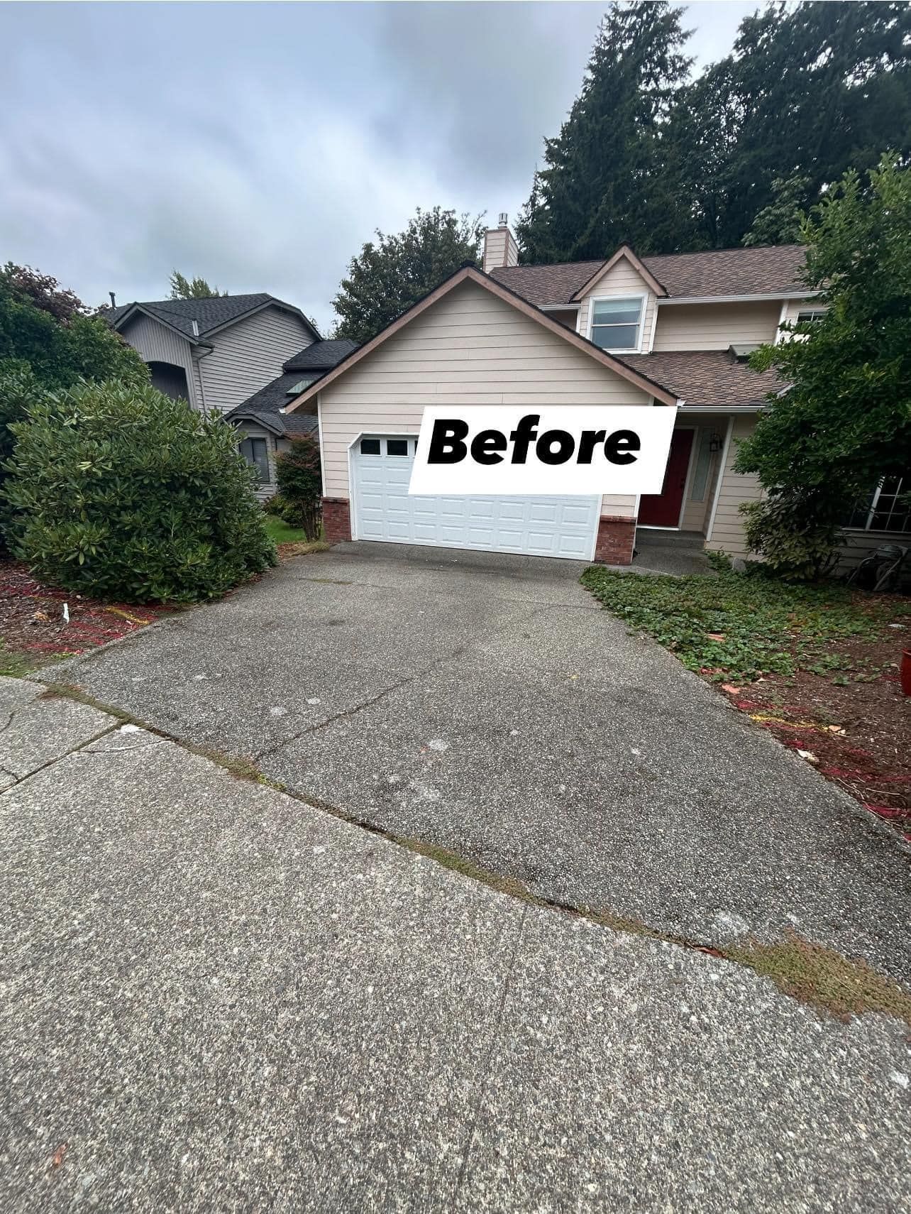 House exterior with concrete driveway and garage; 