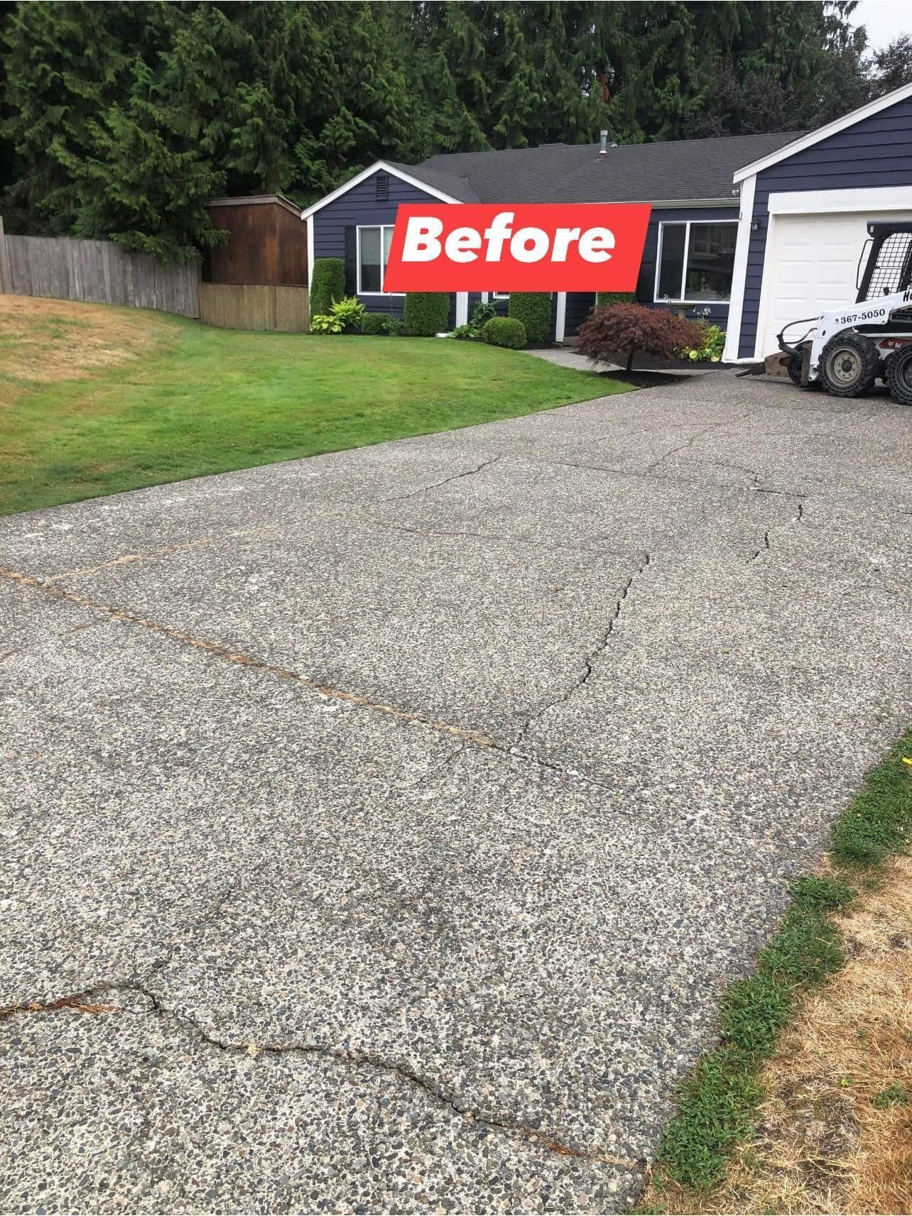 Driveway with cracks in front of a blue house, labeled 