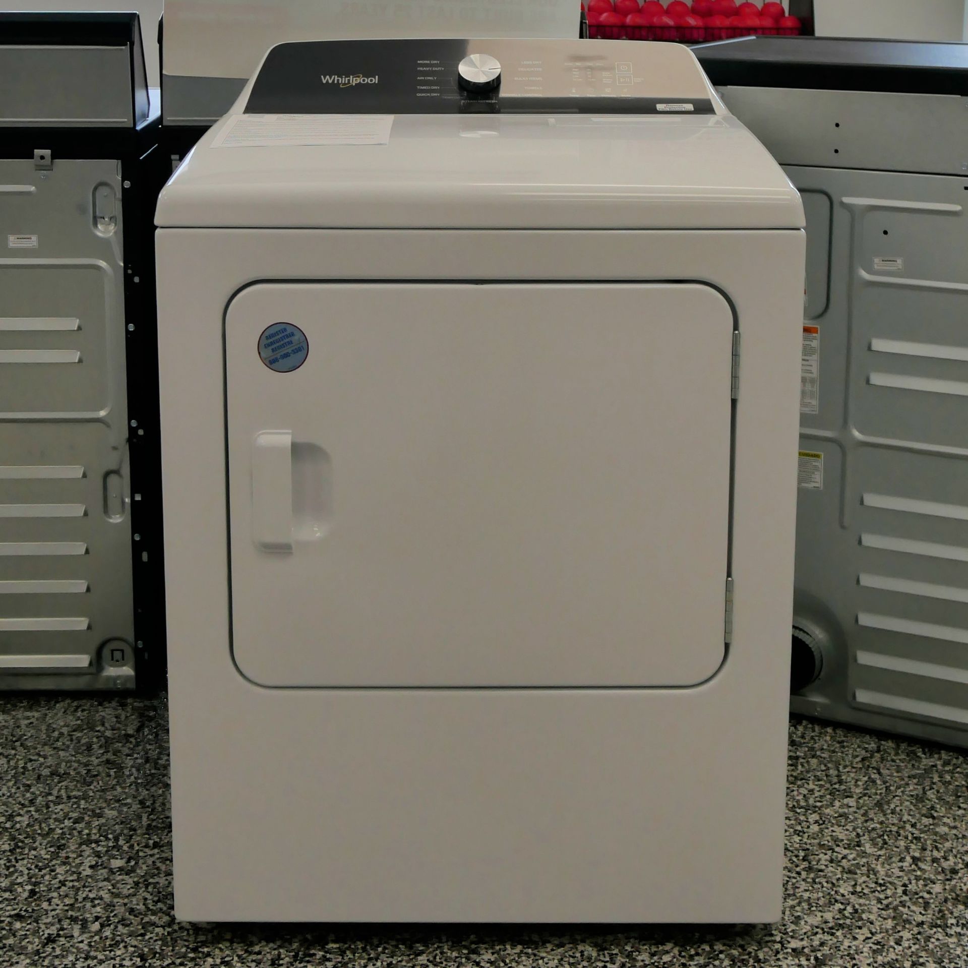 White Whirlpool dryer with black top, silver knob, and front-loading door.