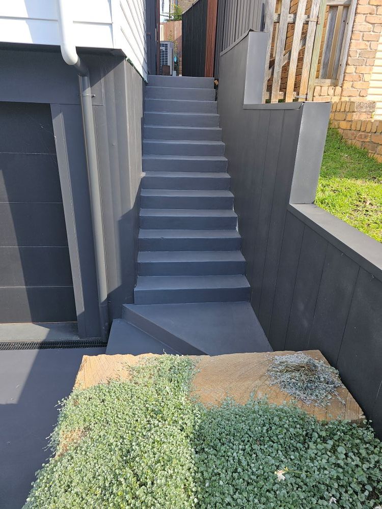 A Set of Stairs Leading Up to a Garage Next to a House — Mid North Coast Spray Pave in South West Rocks, NSW