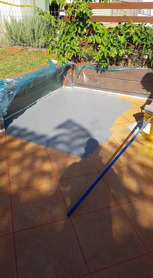 Backyard Patio with A Large Gray Tarp or Canopy Spread on The Ground — Mid North Coast Spray Pave in Port Macquarie, NSW