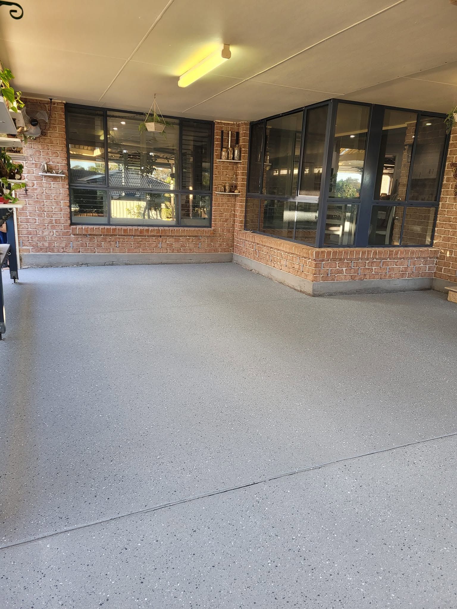 Covered Brick Building Entrance with Large Windows — Mid North Coast Spray Pave in Port Macquarie, NSW