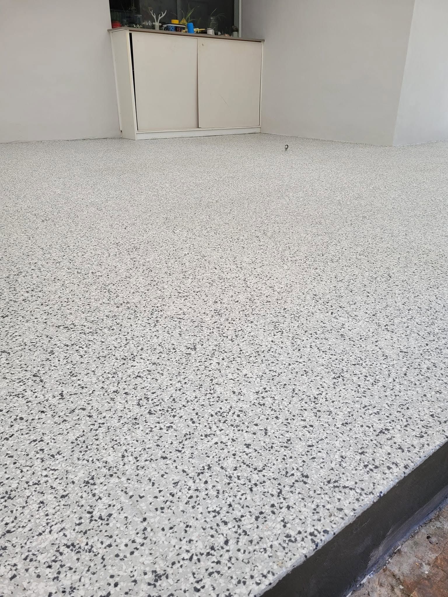 Speckled White Floor in A Small Room — Mid North Coast Spray Pave in Port Macquarie, NSW