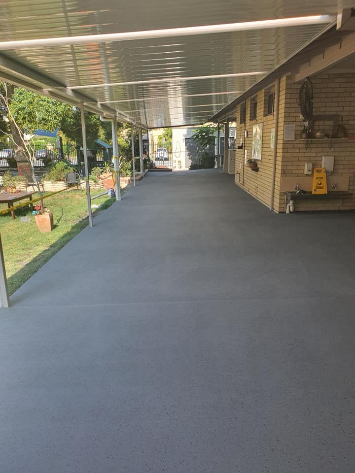 A Long Hallway Leading to a House With a Covered Walkway — Mid North Coast Spray Pave in South West Rocks, NSW
