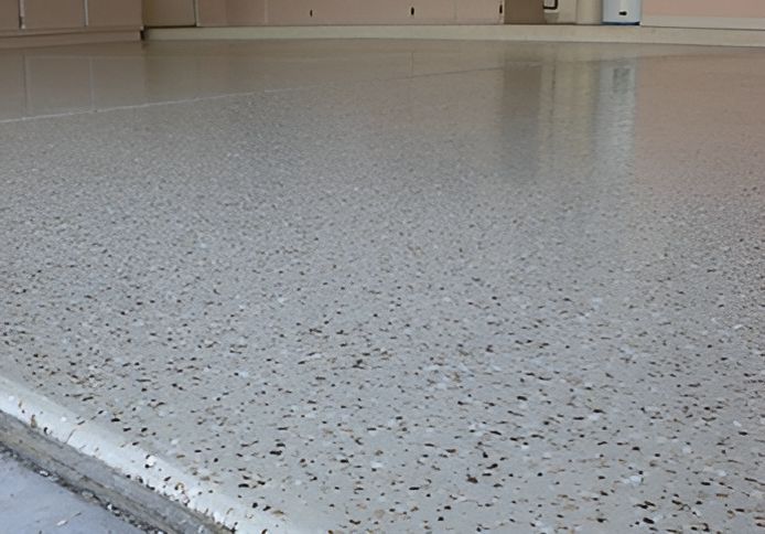 A Close Up of a Shiny Concrete Floor in a Garage — Mid North Coast Spray Pave in Port Macquarie, NSW