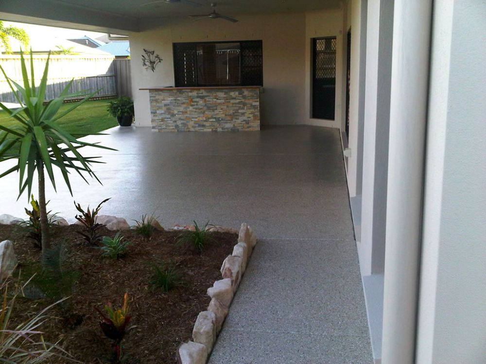 A Patio With a Stone Counter Top and a Ceiling Fan — Mid North Coast Spray Pave in Port Macquarie, NSW