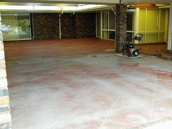 A Brick Building With a Red Tiled Floor and a Vacuum Cleaner on the Floor — Mid North Coast Spray Pave in Port Macquarie, NSW
