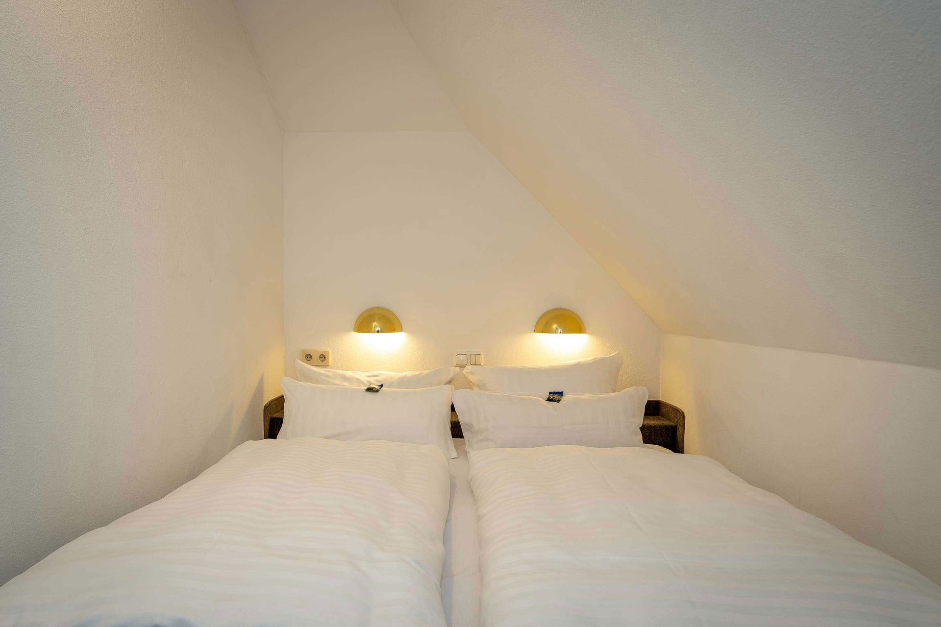 Gemütliches Doppelbett im Apartment des Boutique Hotel Rosengarten in Wellingsbüttel
