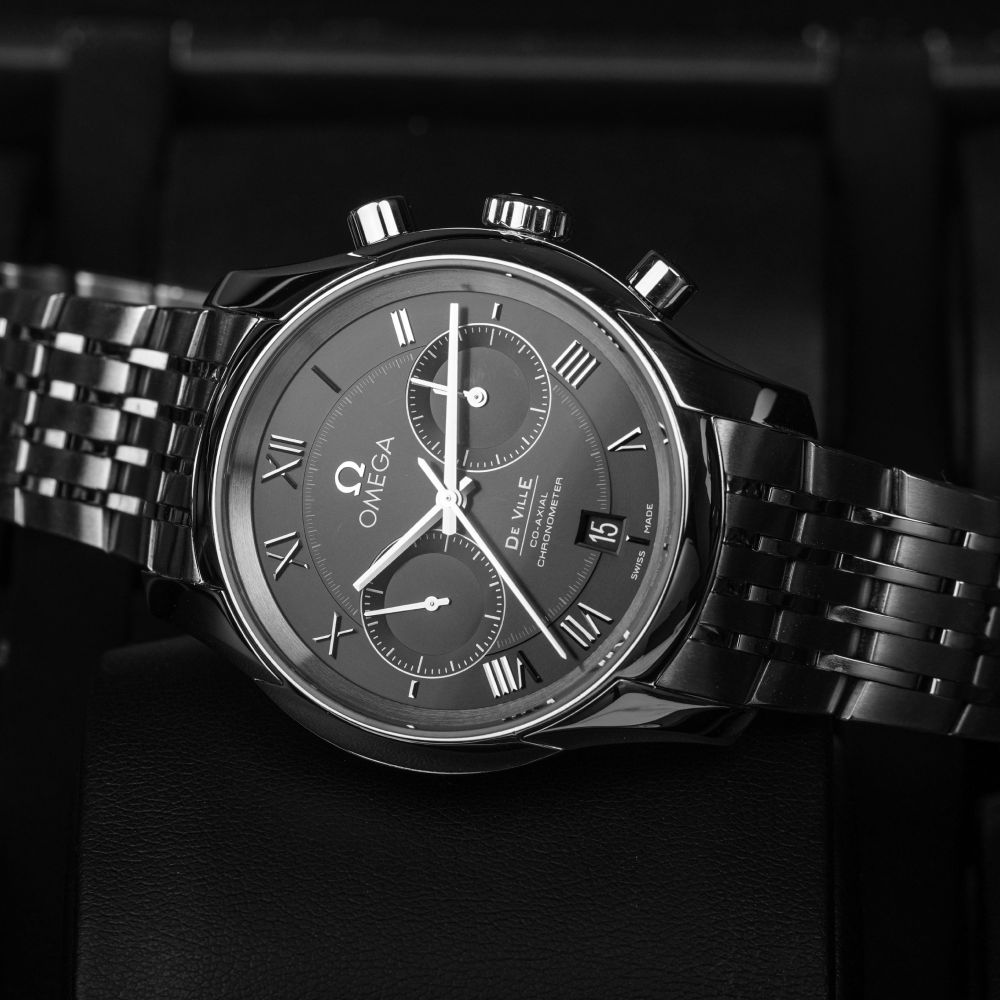 Silver chronograph wristwatch on a white background.