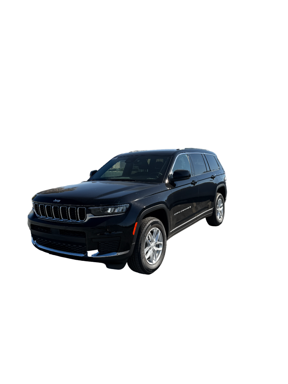 A white jeep grand cherokee with black wheels on a white background.