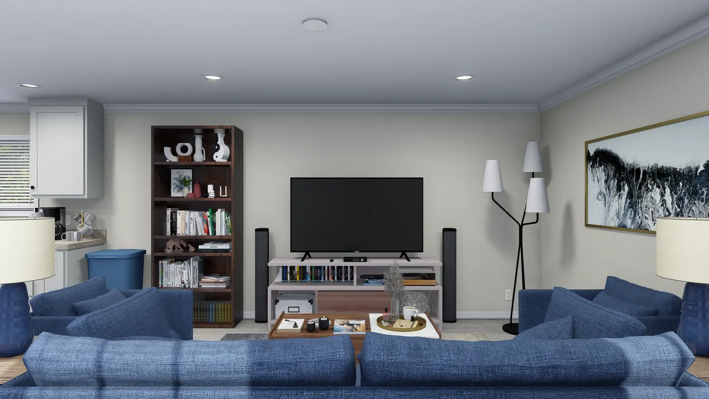 Living room with blue sofas, TV, bookshelf, and wall art.