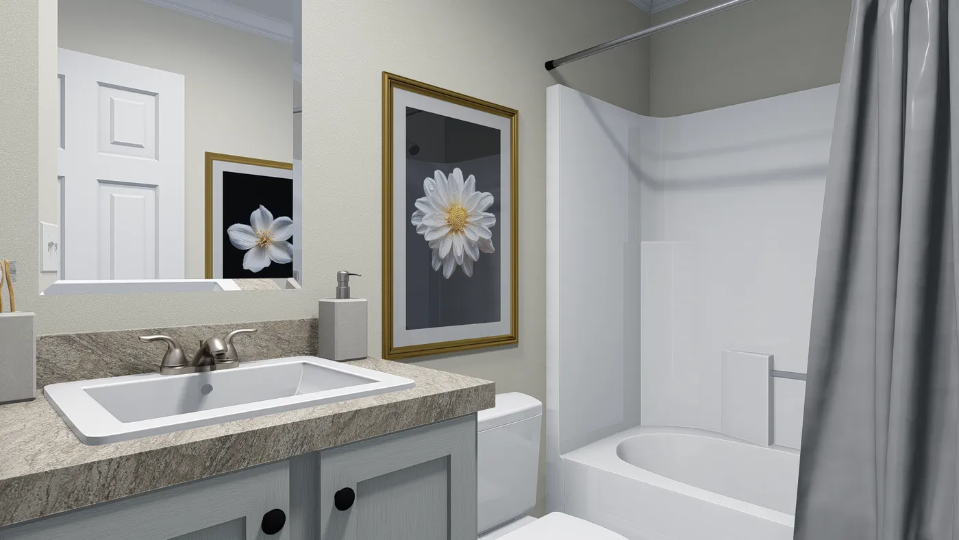 Bathroom with a white bathtub, toilet, and sink. Gray shower curtain and neutral wall paint.
