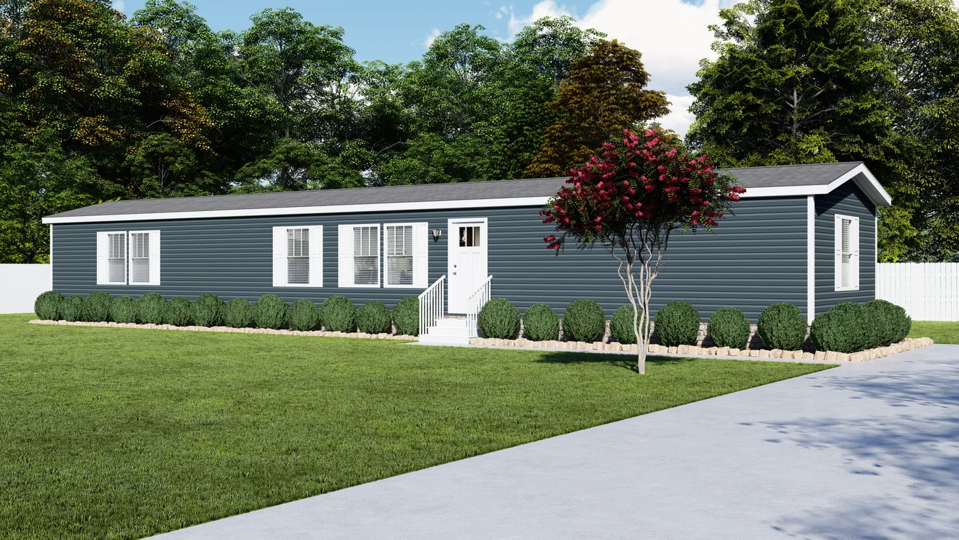 Blue-sided manufactured home with white trim and a green lawn. A small tree with red flowers is in front.