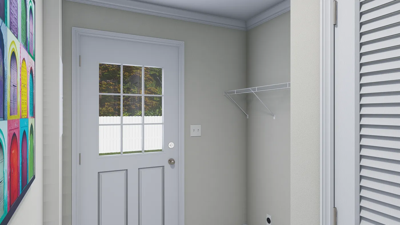 Interior of a light-colored entryway with a white door, a wire shelf, and a colorful framed artwork.