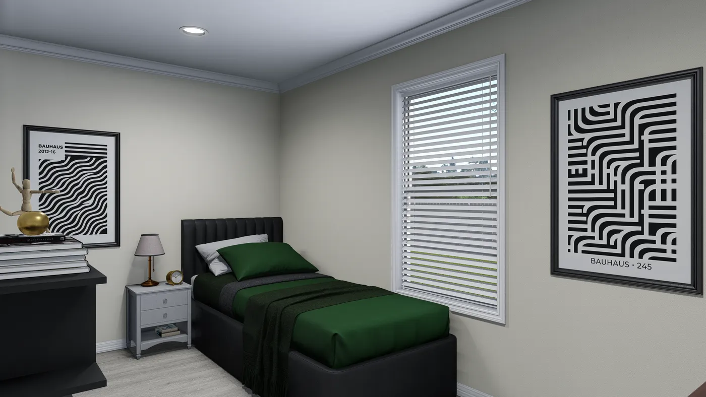 Bedroom with a bed, nightstand, and framed artwork; walls are light beige.