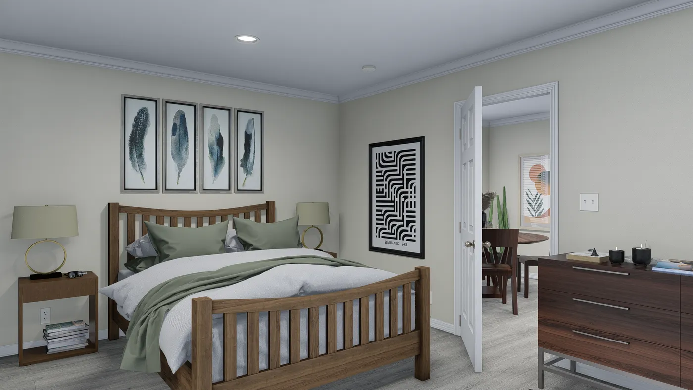 Bedroom interior with a bed, artwork, and open doorway to another room.